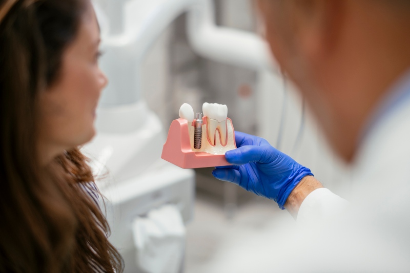 Doctor suggesting full mouth dental implant to a patient in Tempe, AZ